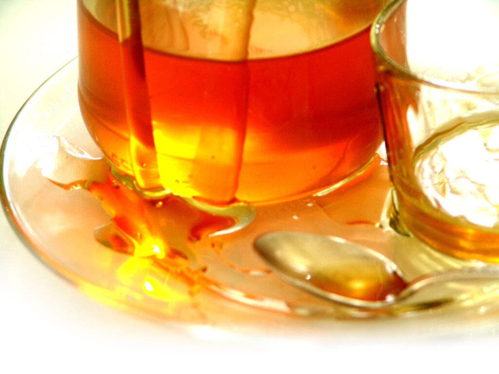 Amber-colored tea in glass tea pot