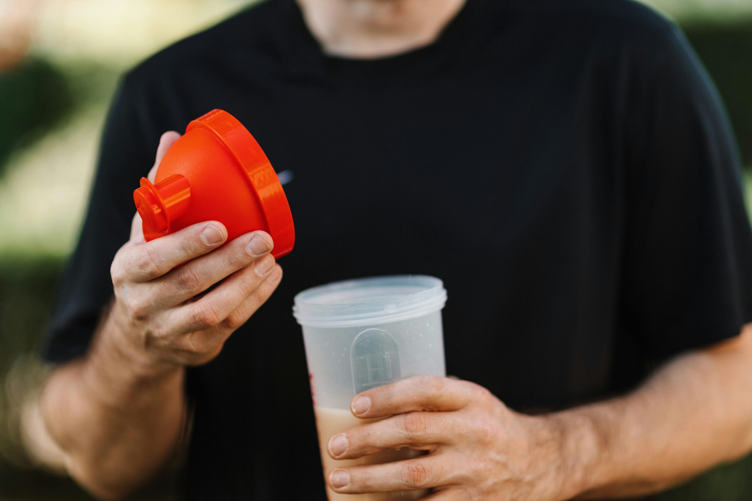 man holding a blended liquid