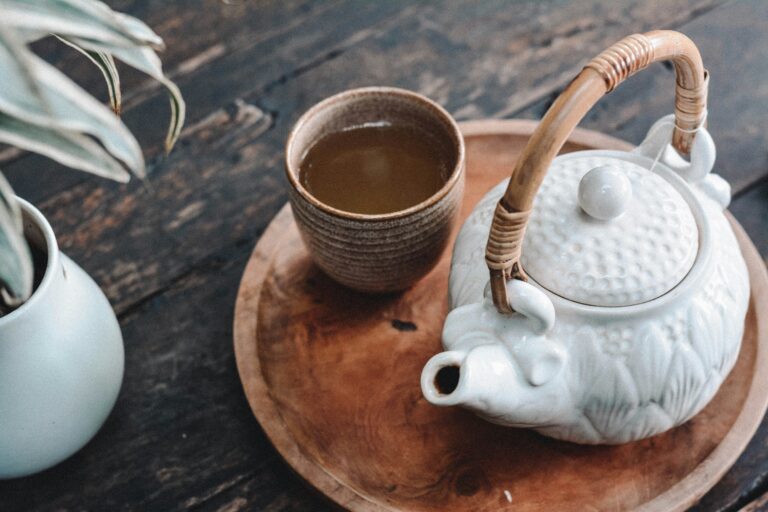 Ceramic tea cup and kettle
