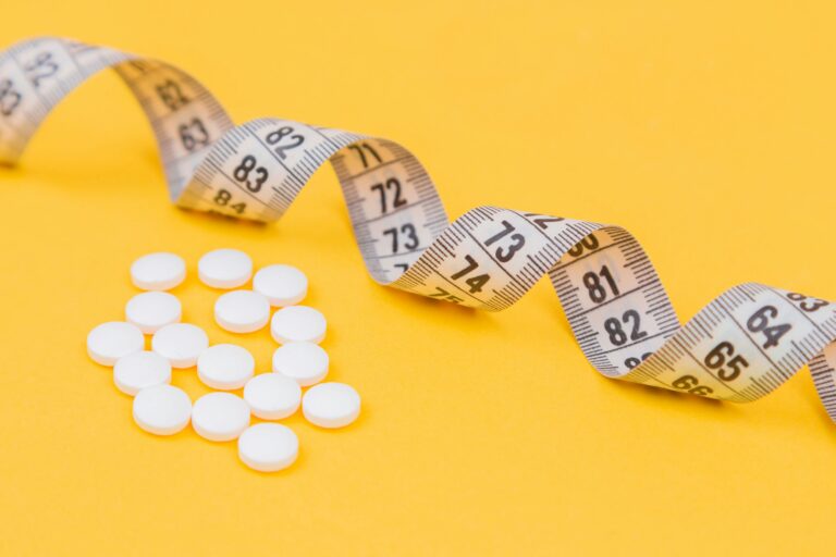tape and pills on a yellow background