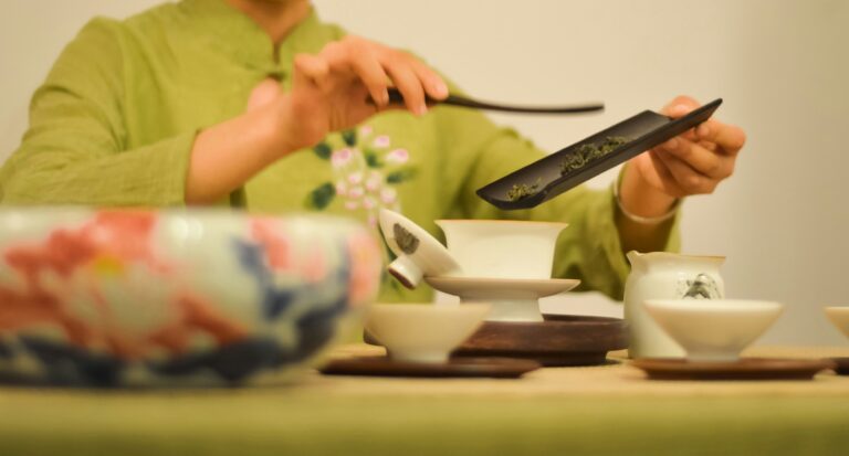 Man pouring tea into tea