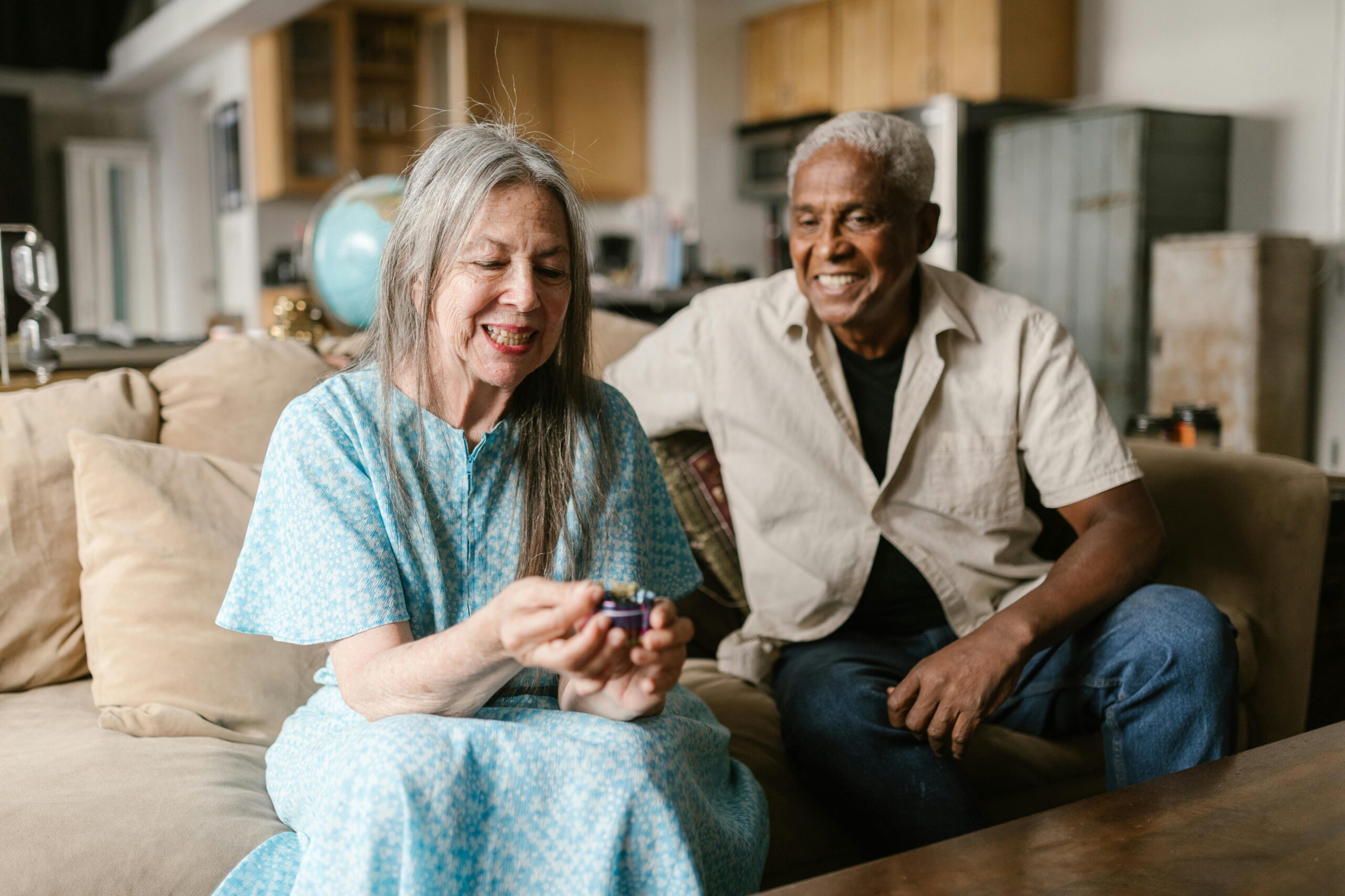Two elderly people on a couch
